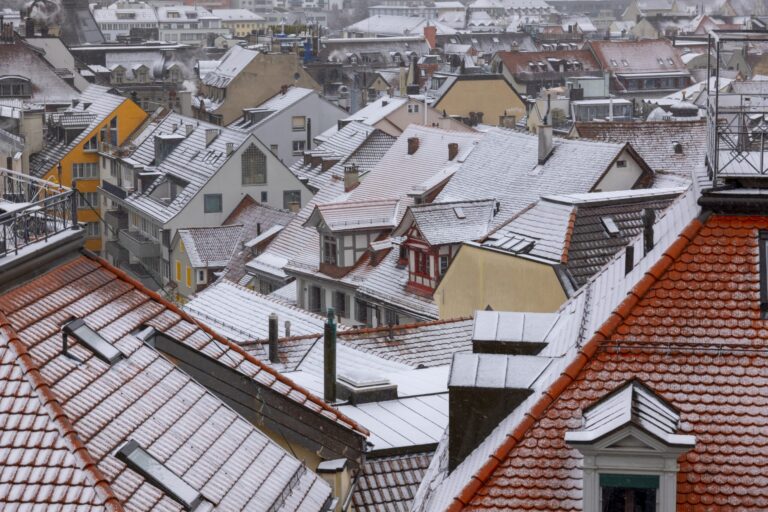 A high angle shot of the cityscape of St Gallen, Switzerland in winter with snow on roofs